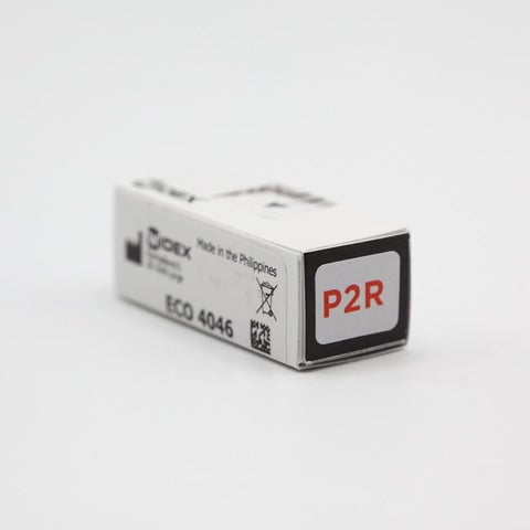A small white box labeled P2R, with ECO 4046 and Made in the Philippines on the side, sits on a white surface—designed for Easywear wired RIC (P-Receiver) use.